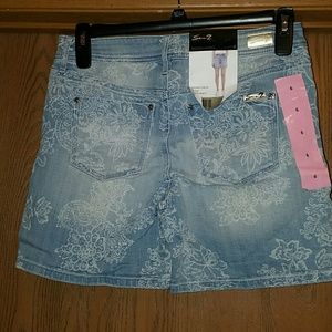 Seven blue flowered jean shorts